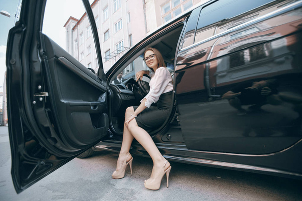 Business woman in car - 写真・画像