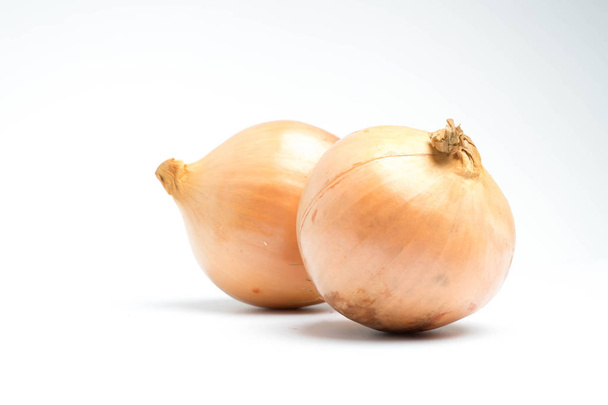ripe onion on a white background - Фото, изображение