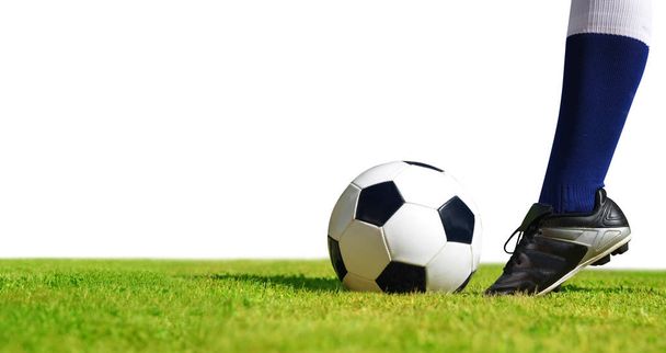 Soccer ball with feet player on the football field on white background. - Φωτογραφία, εικόνα
