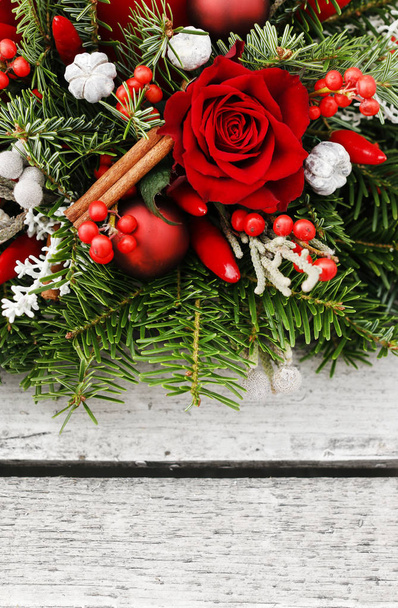 Christmas decoration with red roses, fir, brunia and cinnamon st - Photo, image