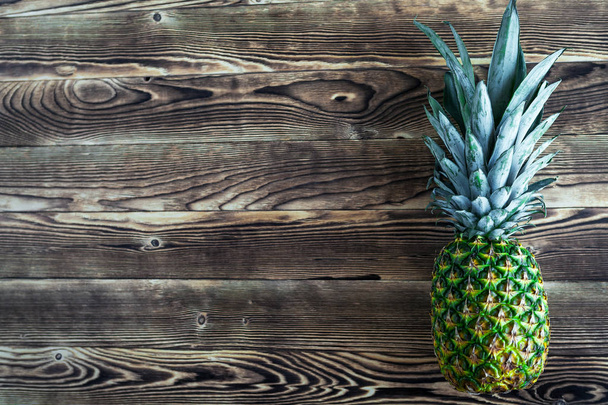pineapple  on a wooden background - Fotoğraf, Görsel