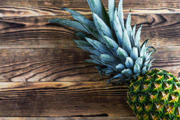 pineapple  on a wooden background - Фото, зображення