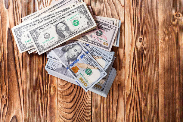dollars   on a wooden background - Foto, Imagem