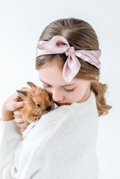 girl holding adorable furry rabbit isolated on white - Zdjęcie, obraz