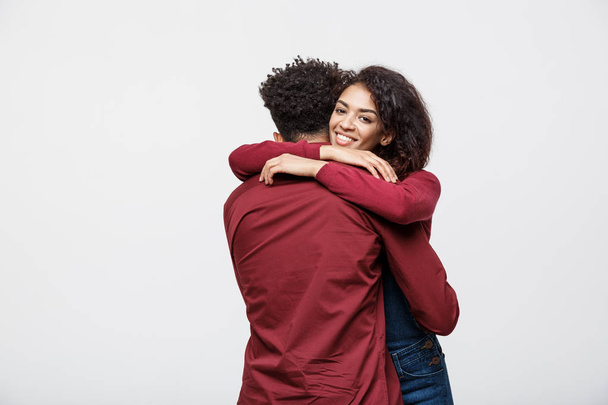 portrait of happy african american couple hug each other on white background. - Φωτογραφία, εικόνα