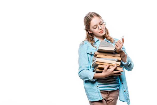 cute teenage girl in eyeglasses reading book isolated on white - Fotó, kép