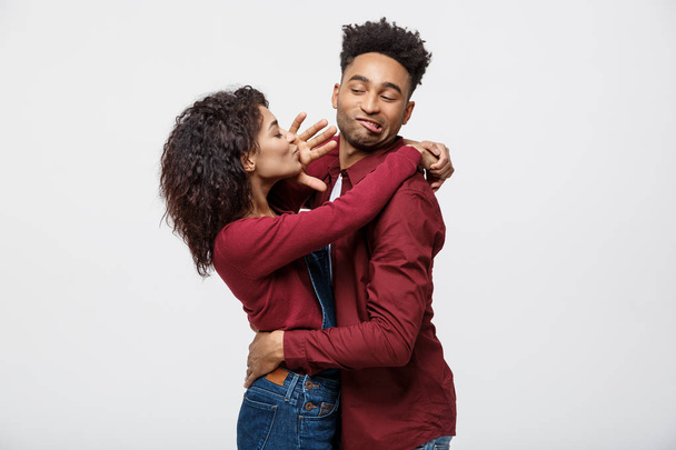 Close-up of African American young couple deny kissing over white background studio - Valokuva, kuva