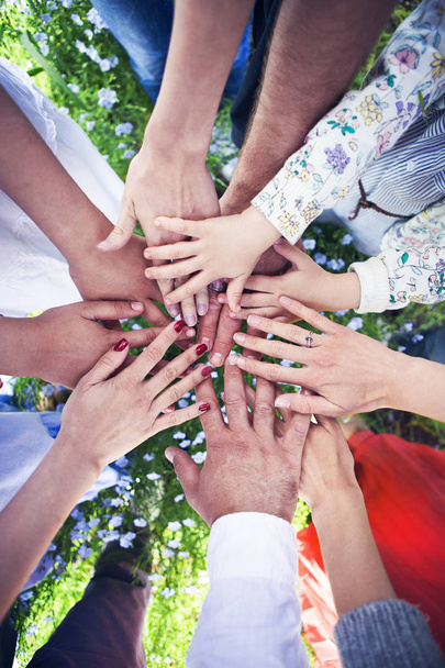 Group of friends with their hands in a complete circle - Photo, Image
