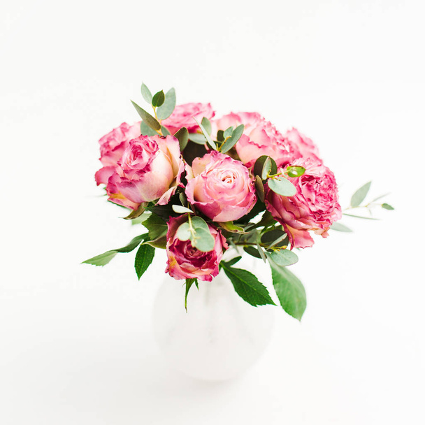 Pink rose flowers bouquet on white background. Minimal festive flower concept. - Photo, Image