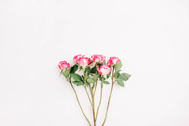 Red rose flowers bouquet. Flat lay, top view minimal spring floral header. - Foto, immagini