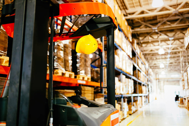 Picture of forklift machine parked in storage warehouse - Photo, Image