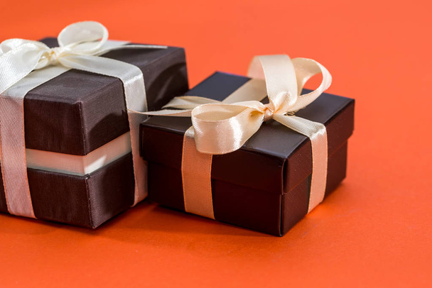 two brown gift box isolated on orange - Zdjęcie, obraz