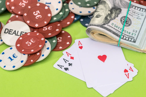 Poker chips and play card with dollar on green - Fotó, kép