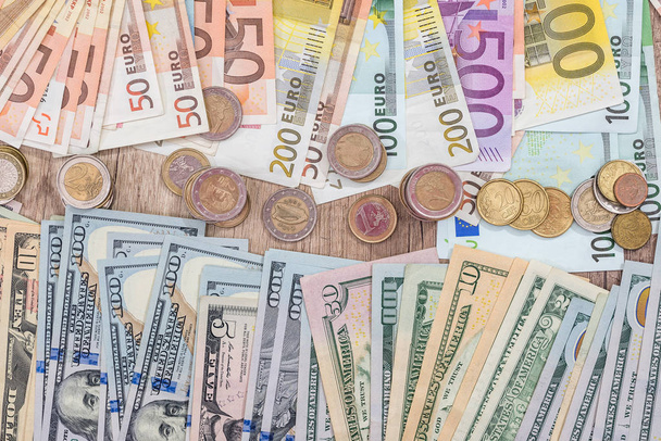 euro coin with dollar and euro bills. close up - Фото, зображення