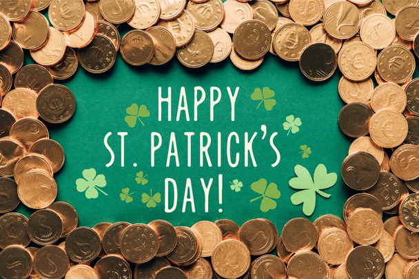 flat lay with golden coins and happy st patricks day lettering on green background - Fotó, kép