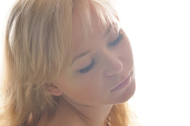 Attractive blonde woman portrait on white background - Fotó, kép