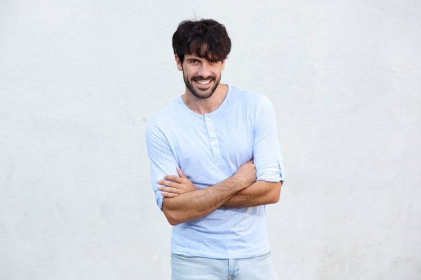 Portrait of cool guy with beard smiling against white background - Photo, Image