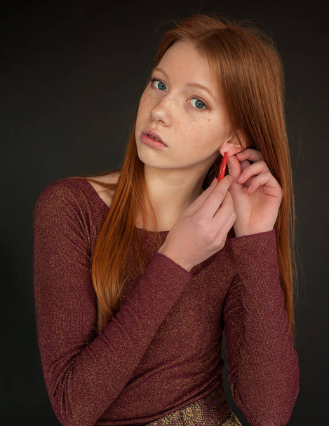 Studio portrait of natural beauty of caucasian redhead girl - Fotó, kép