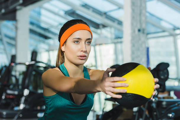sporty woman training with medicine ball at gym  - Fotografie, Obrázek