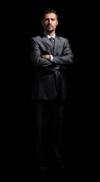 Handsome mature business man isolated on black background - Foto, afbeelding