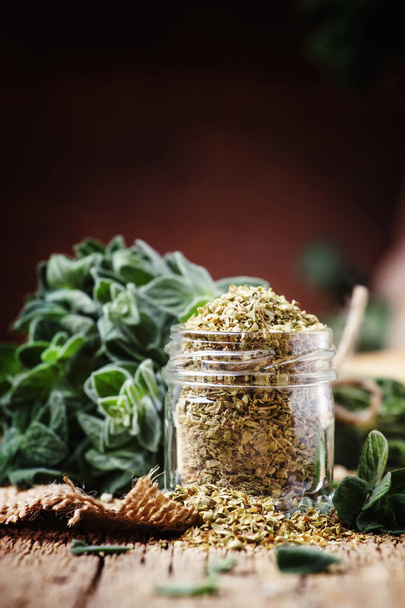 Dried and fresh oregano, vintage wood background, rustic style, selective focus - Photo, Image