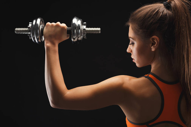 Athletic woman with dumbbell - Photo, Image