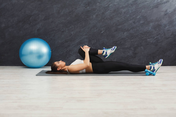 Fitness woman stretching indoors - Foto, Imagem