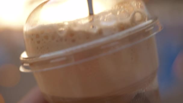 Takeaway cold coffee with straw - Кадри, відео
