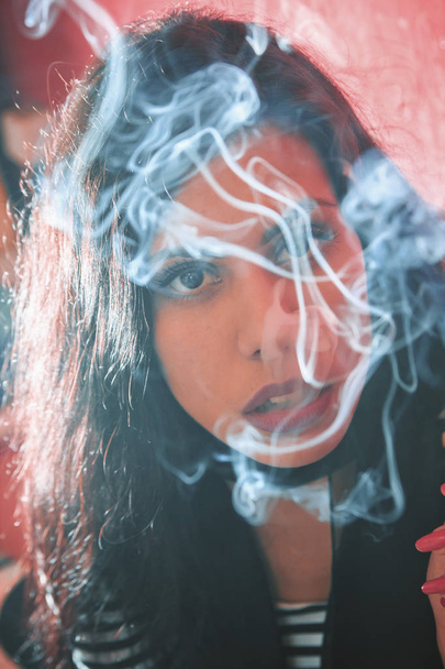 Classy woman smoking a cigarette - Φωτογραφία, εικόνα