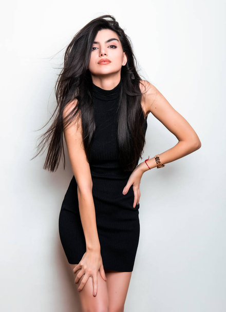 beautiful young woman with long black hair wearing black dress - Fotoğraf, Görsel