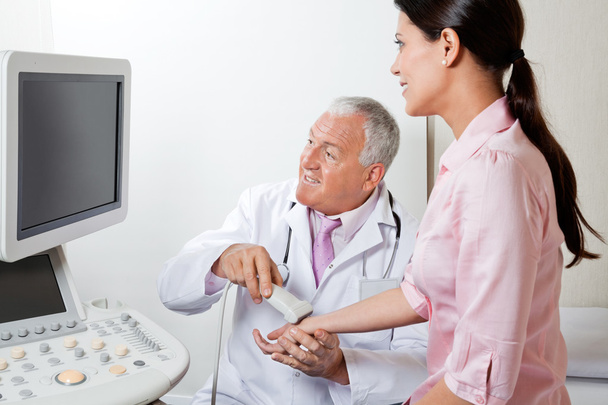 Radiologist Scanning Female Patient's Hand - 写真・画像