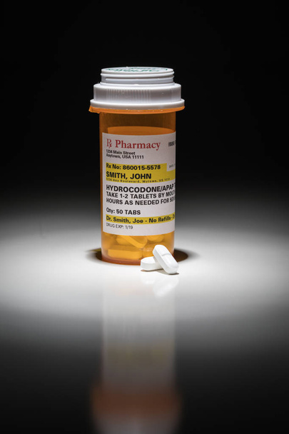 Hydrocodone Pills and Prescription Bottle with Non Proprietary Label. No model release required - contains ficticious information. - Photo, Image