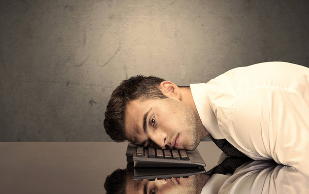 Frustrated businessman's head on keyboard - Photo, image