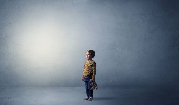 Little waggish kid in an empty room - Photo, Image