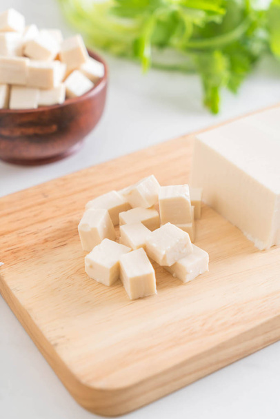 tofu on wooden board - Фото, изображение