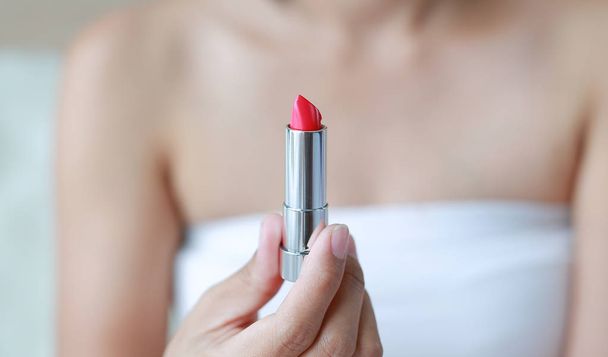 Portrait of beautiful woman open lipstick. Beauty Concept. - Фото, зображення
