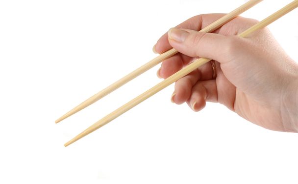 Hand holding the chopsticks - Фото, зображення