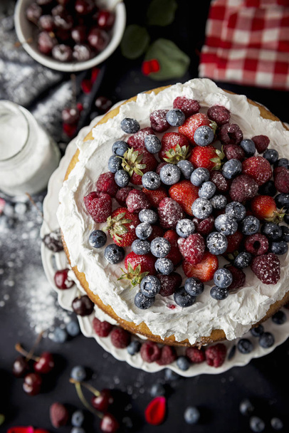 Beautiful, fruit naked cake on a dark tablecloth - Photo, Image