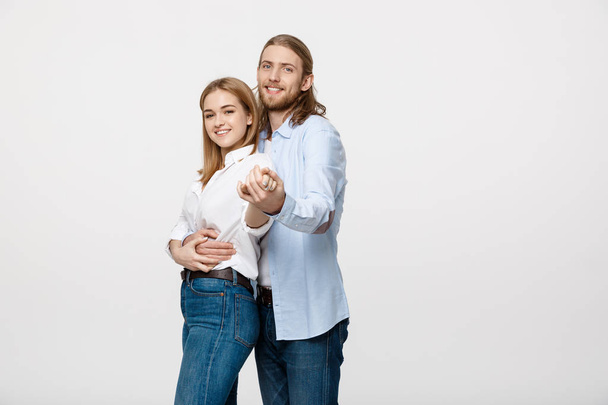 Young elegant couple in casual cloth dancing over Isolated on white studio background. - Valokuva, kuva