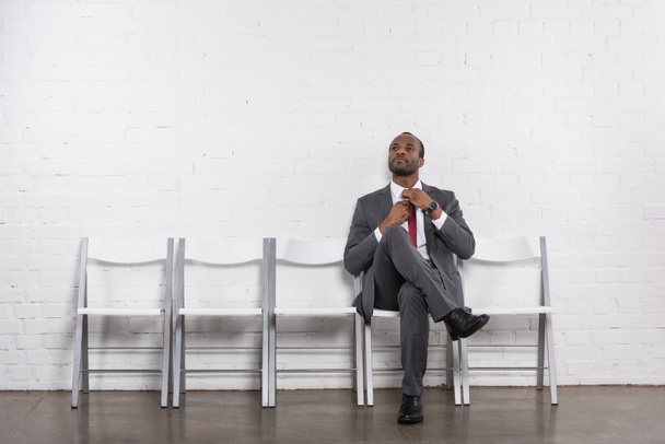 african american businessman in suit waiting for job interview - Fotó, kép