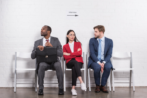 multiethnic business people sitting on chairs while waiting for job interview - Photo, Image