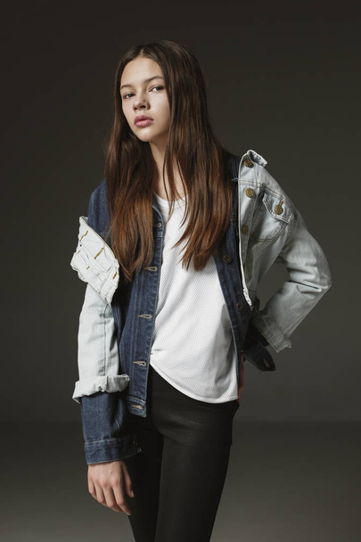 Stylish young teen girl over gray background - Фото, изображение
