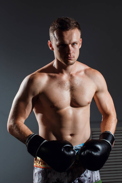 handsome man or healthy boxer or Thai boxer with six pack wearing boxing gloves - Φωτογραφία, εικόνα