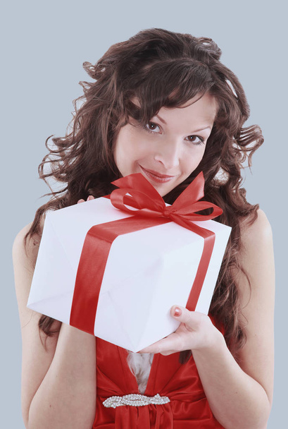 picture of cheerful santa helper girl with gift box - Fotó, kép