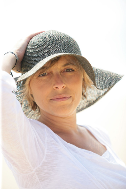 Woman in a summer hat - Photo, image