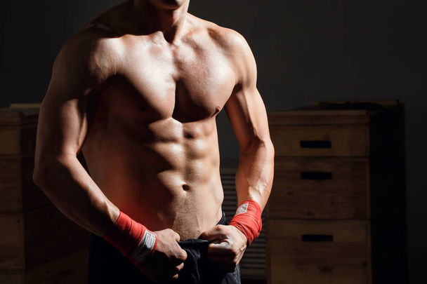 Man with muscular torso showing six pack abs - Photo, image