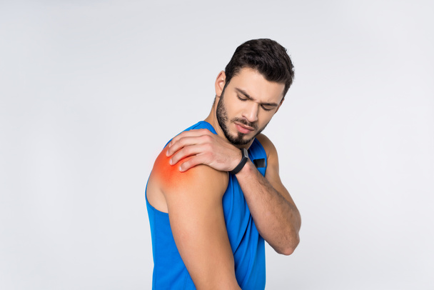 young man with pain in shoulder isolated on white - Foto, afbeelding