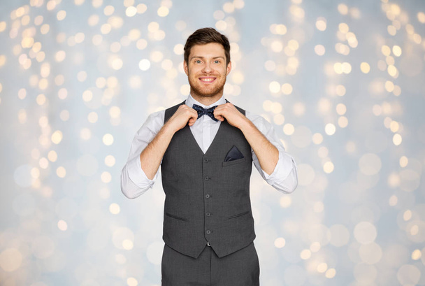 happy man in festive suit dressing for party - Фото, изображение