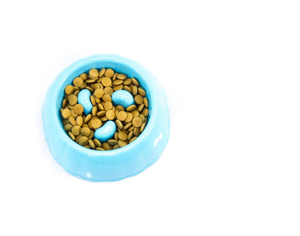 Pet bowl with dry food isolated on white. - Zdjęcie, obraz