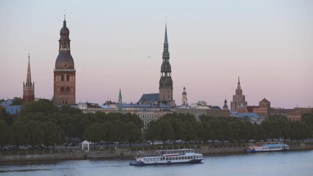 Riga, Latvia. Cruise Ship Floating In Daugava River. Scenic View Of Old Historic Center - Old Church Towers On Background. Travel Destination. UNESCO - Footage, Video
